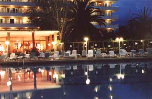 The main hotel pool and lounge at night